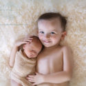Porterville, CA photographer captures a newborn baby with his big brother.