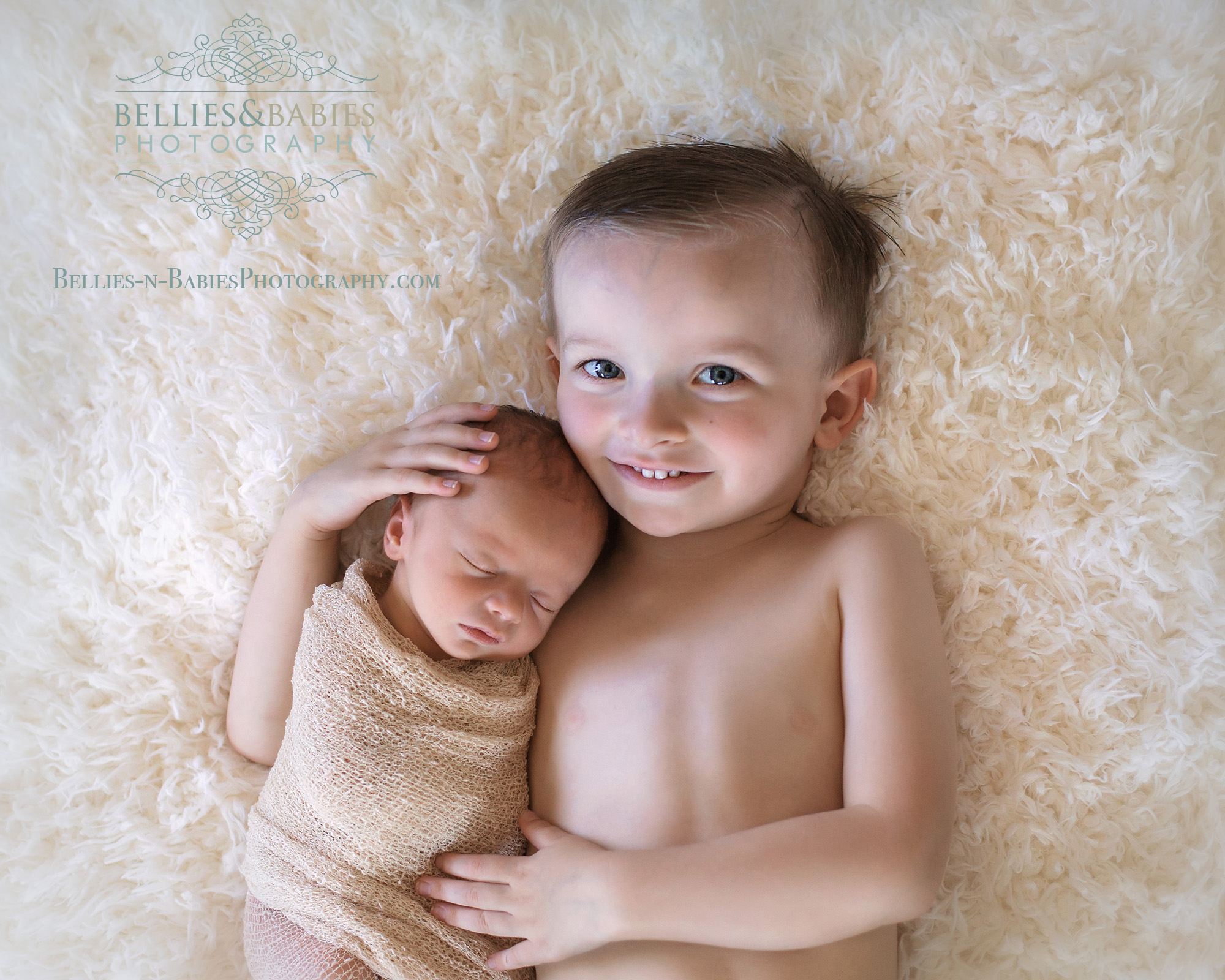 Porterville, CA photographer captures a newborn baby with his big brother.